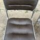Four vintage chairs from the 1960s and 1970s, chrome with faux leather.