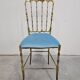 Mid-century Chiavari accent chair in solid brass with a plush seat.