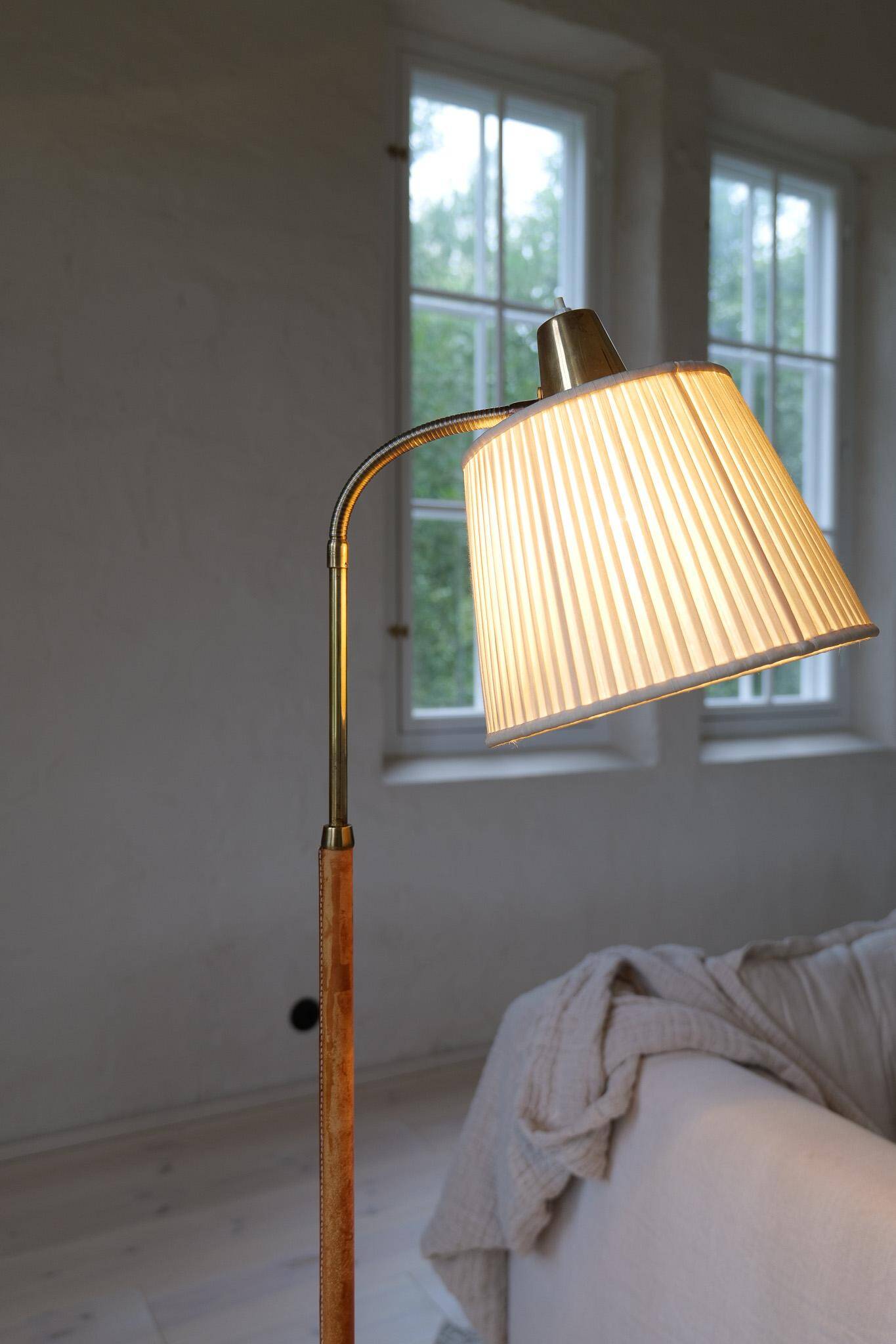 Mid-century brown leather and brass floor lamp, Falkenbergs Belysning, Sweden, 1960s.