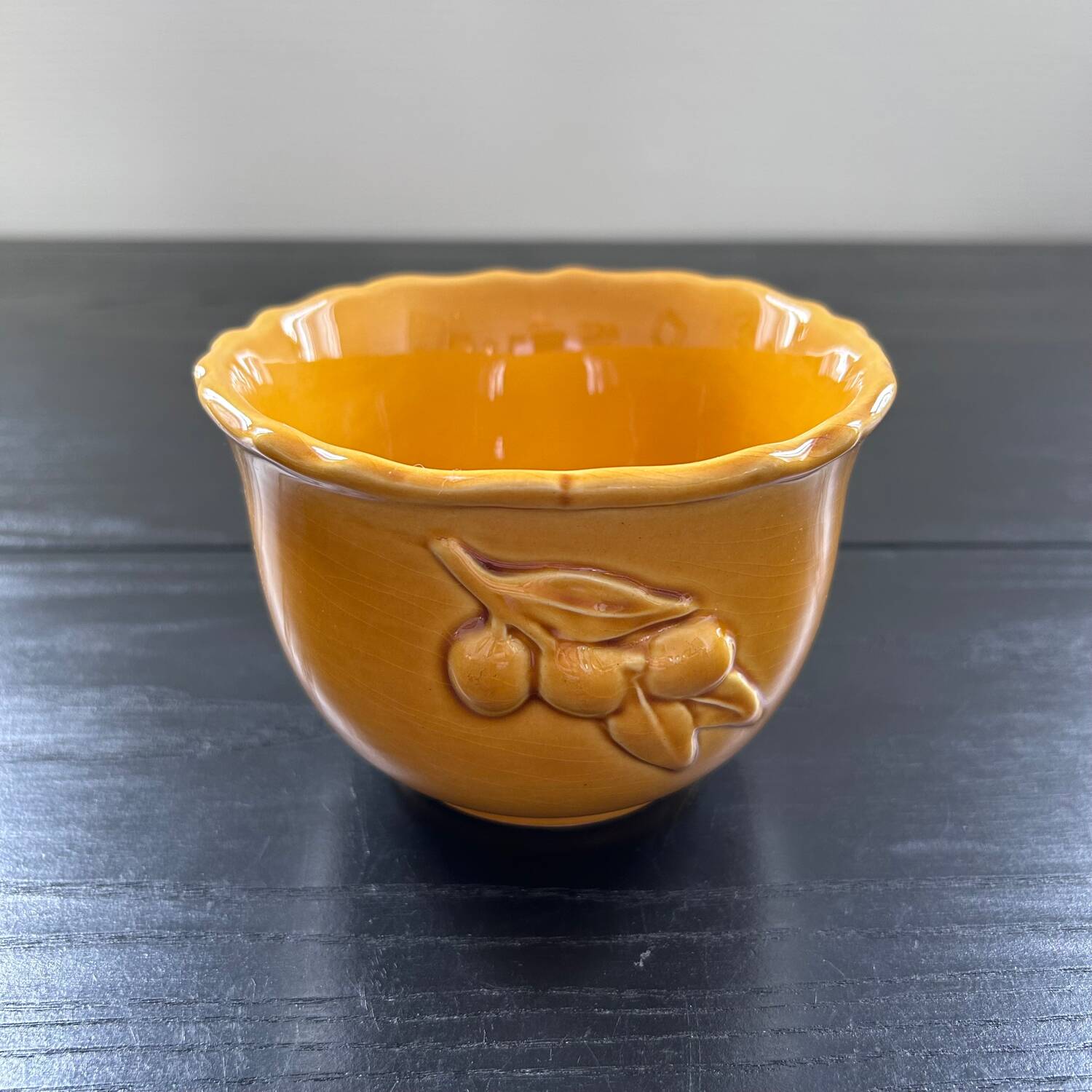 Scalloped bowl with olive decoration