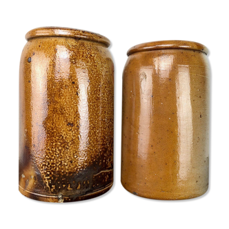 Duo of old salt pots in varnished sandstone