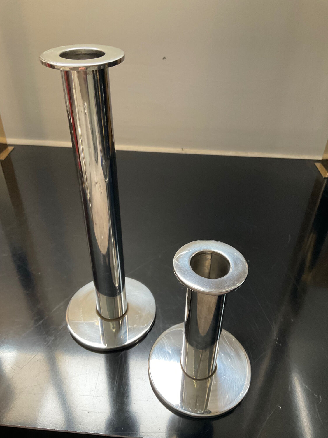 Duo of vintage candle holders in silver metal
