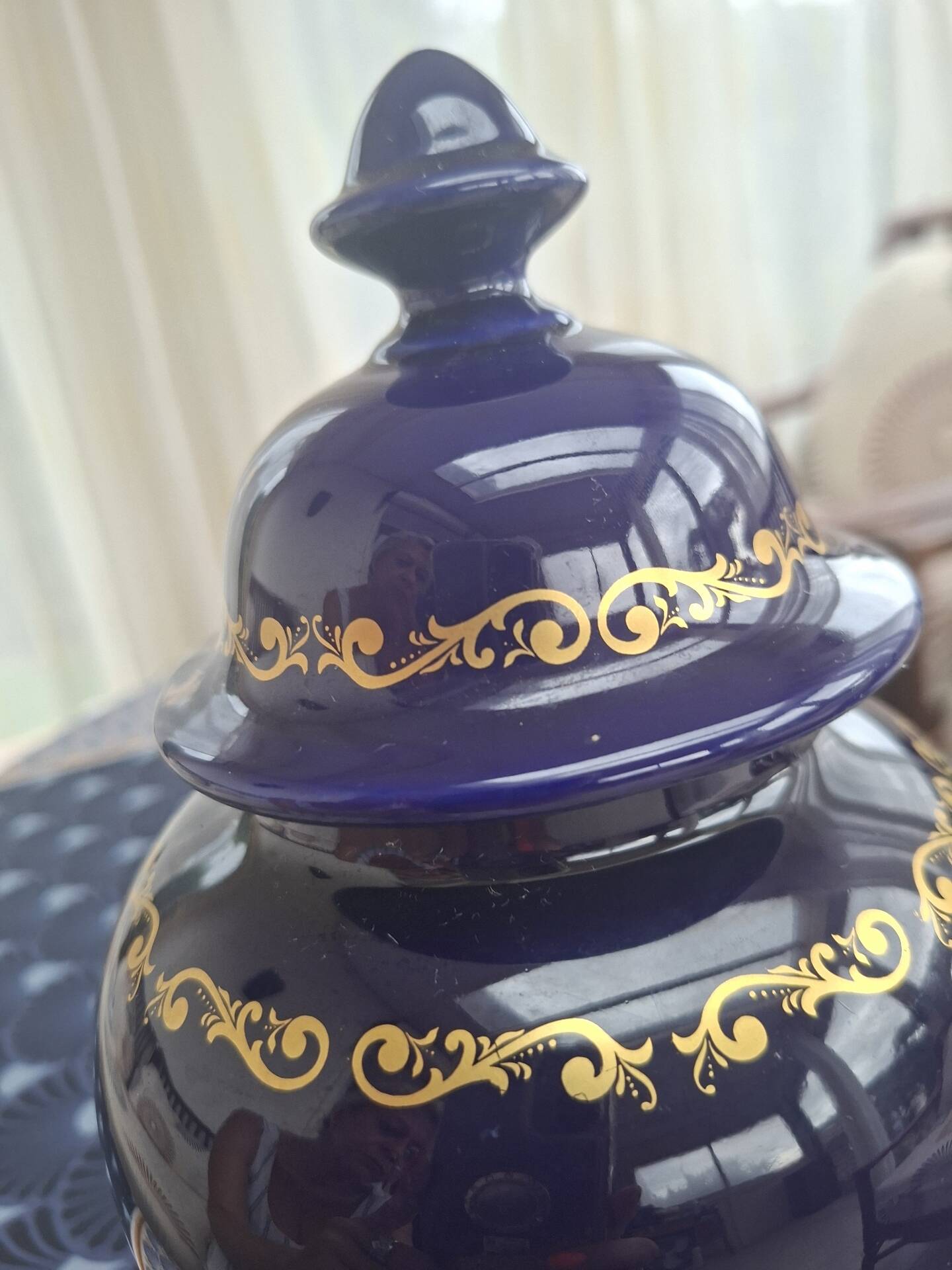 Cobalt blue porcelain bonbonnière with gold decoration on feet.