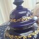 Cobalt blue porcelain bonbonnière with gold decoration on feet.