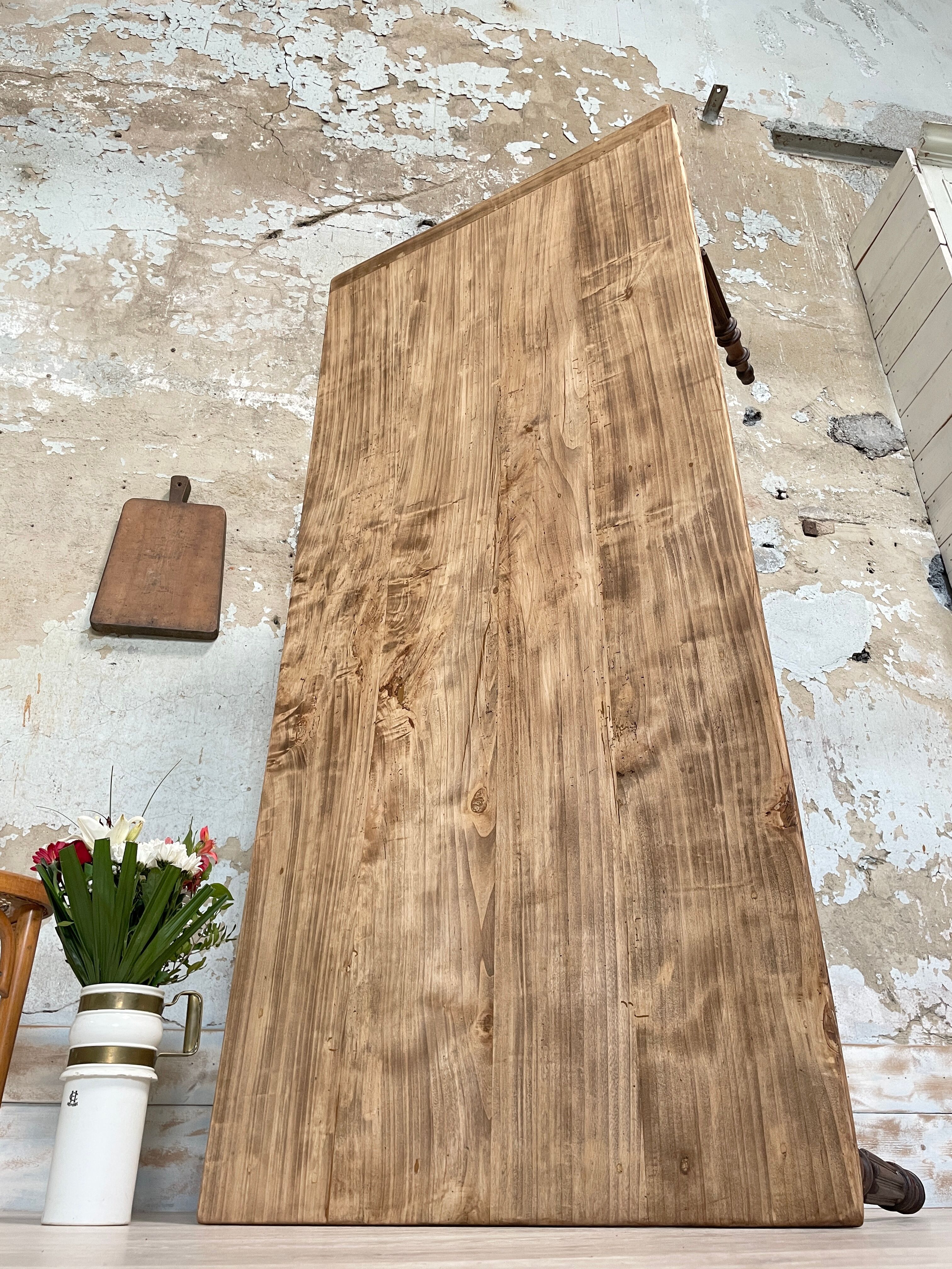 Vintage farmhouse table with turned legs.