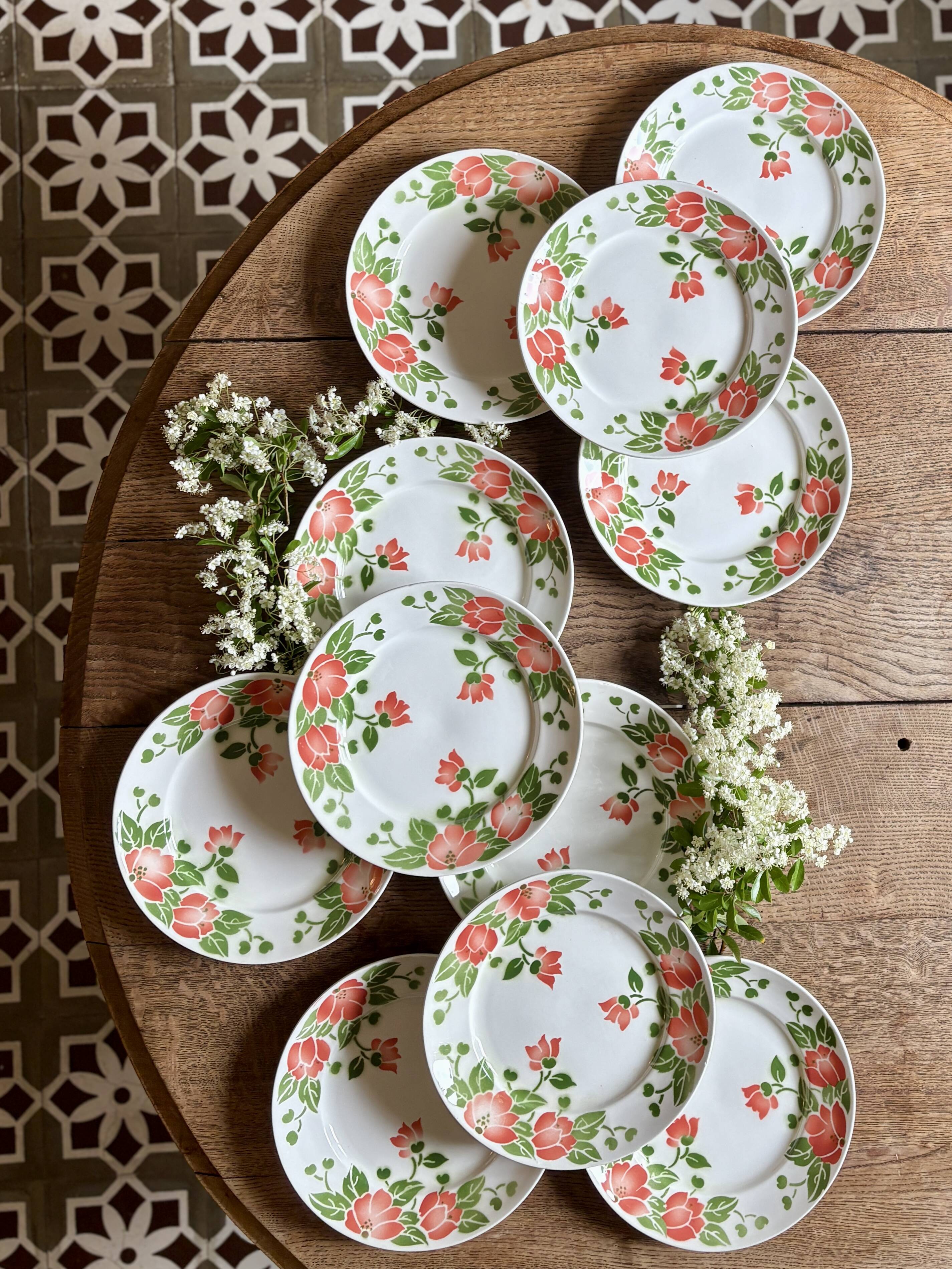 Set of 11 vintage flat plates by Eric de Moulin des Loups.