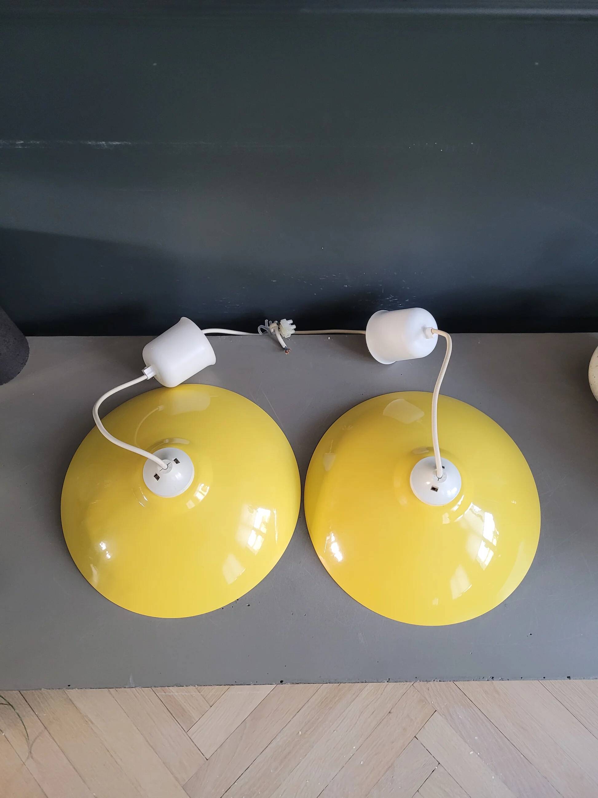 Pair of yellow lacquered metal pendant lights