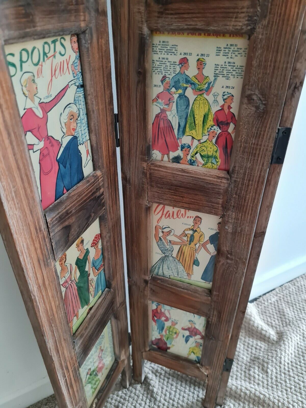 Wooden screen with vintage haute couture images or for photos