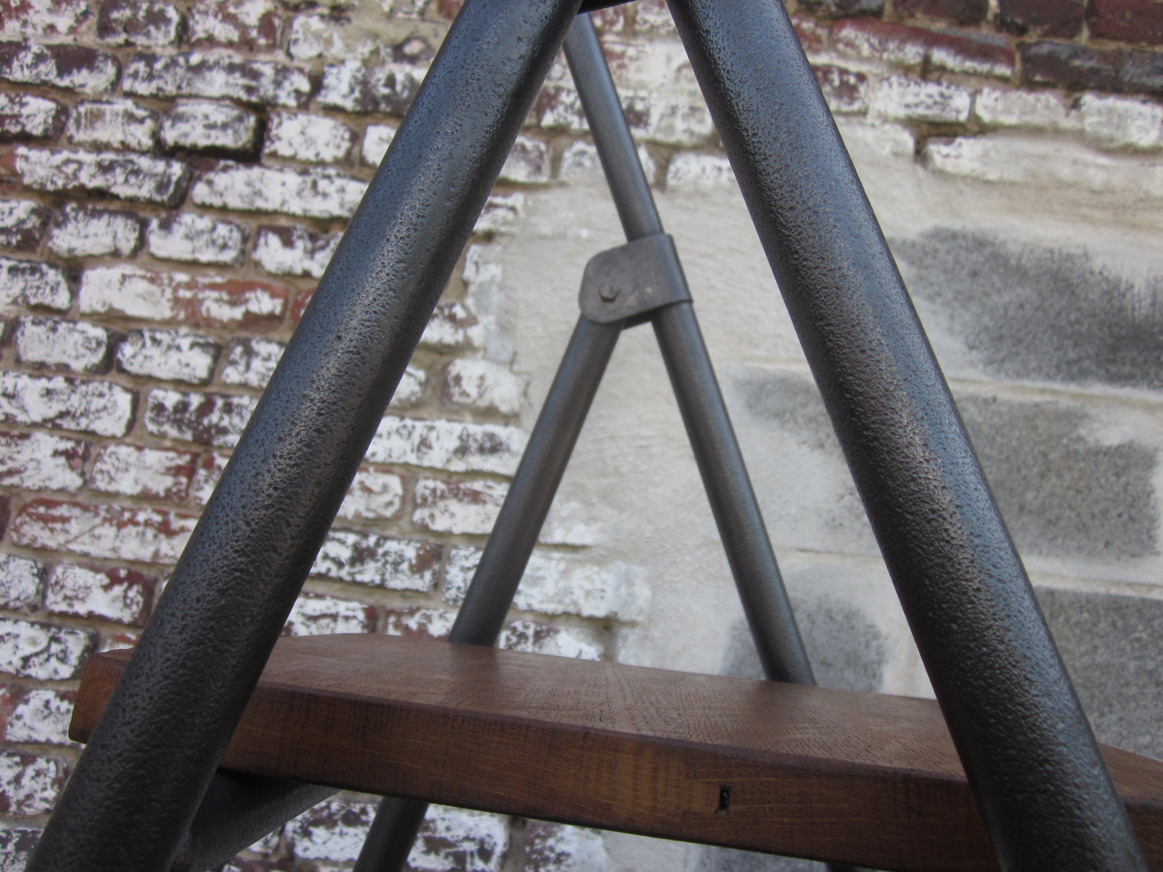 Old stepladder in metal and wood