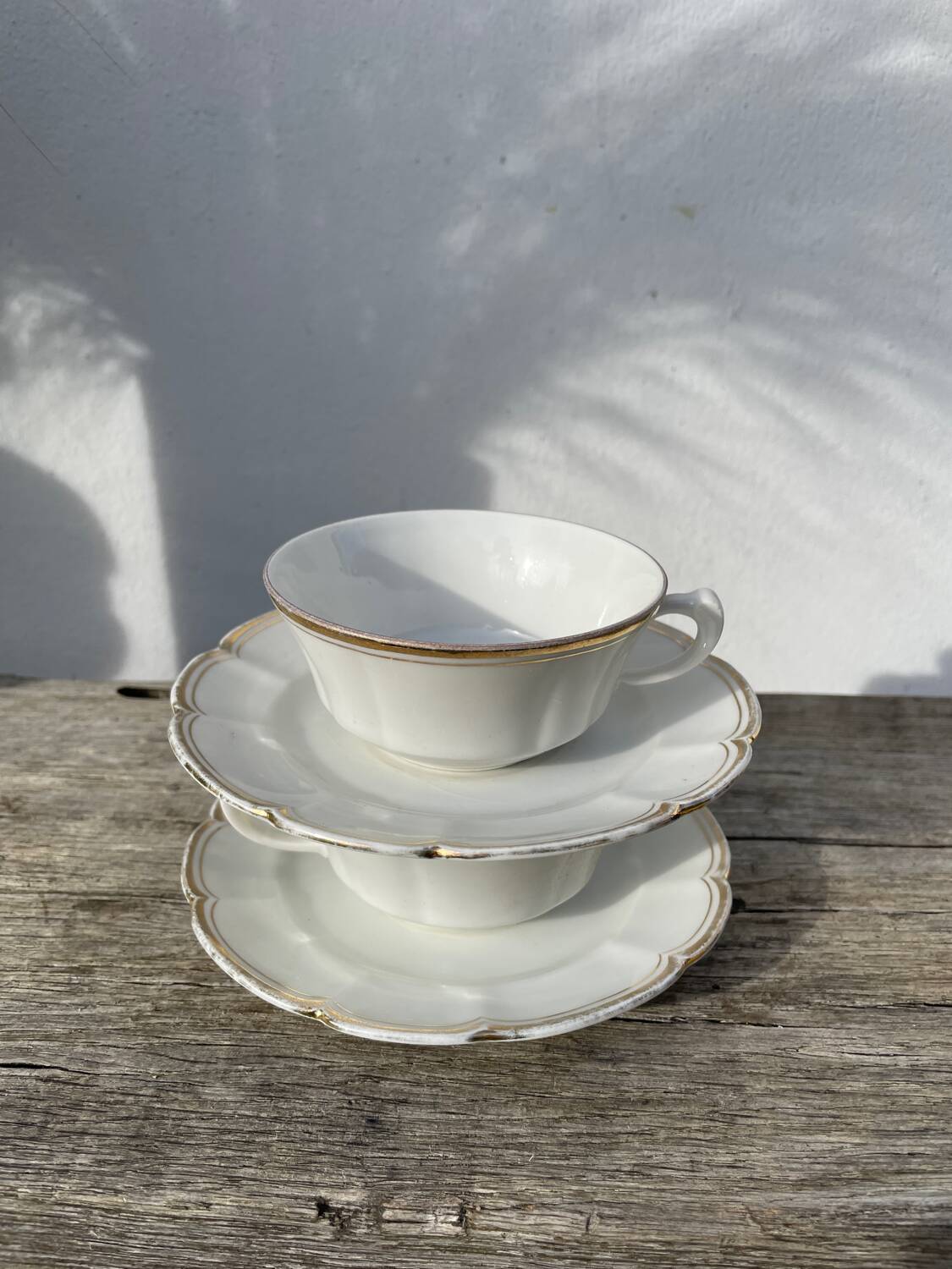 Pair of fine white and gold Limoges porcelain teacups