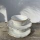 Pair of fine white and gold Limoges porcelain teacups