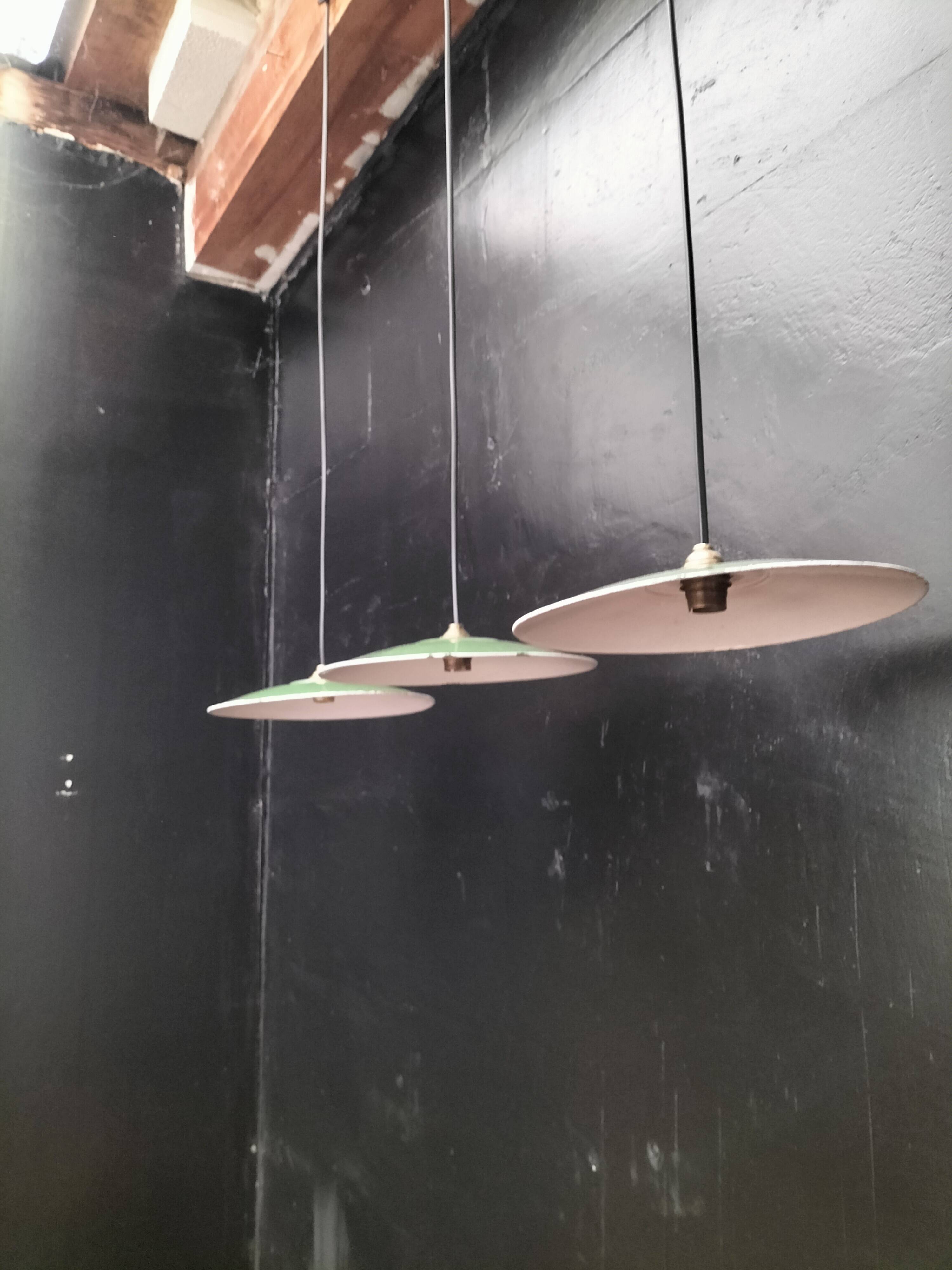 Three enamelled sheet metal suspensions