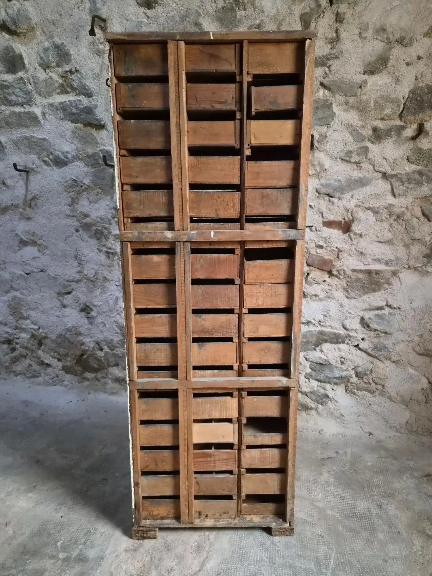 Antique hardware cabinet with 48 drawers, circa 1900.
