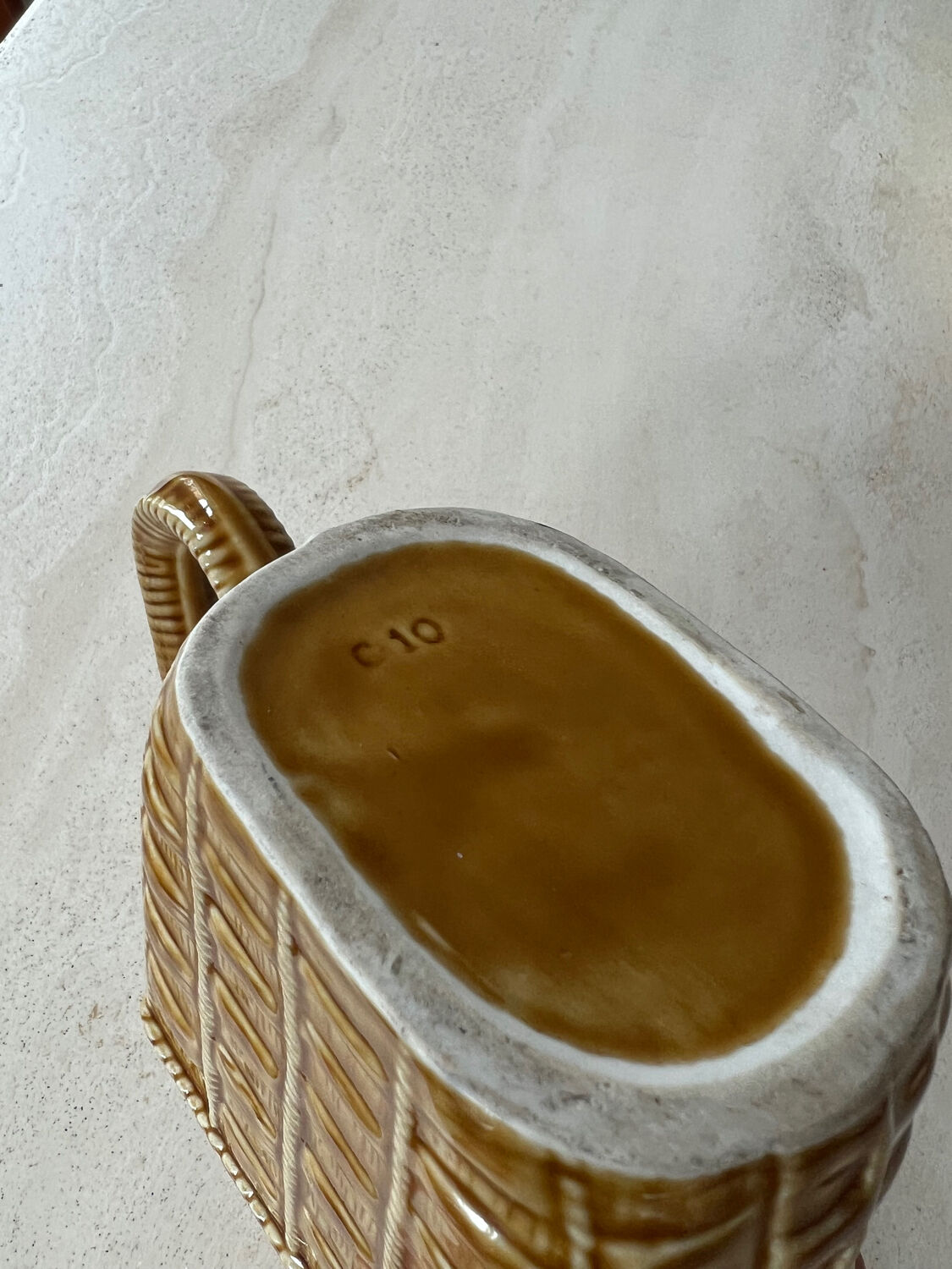 Ceramic pitcher braided pattern