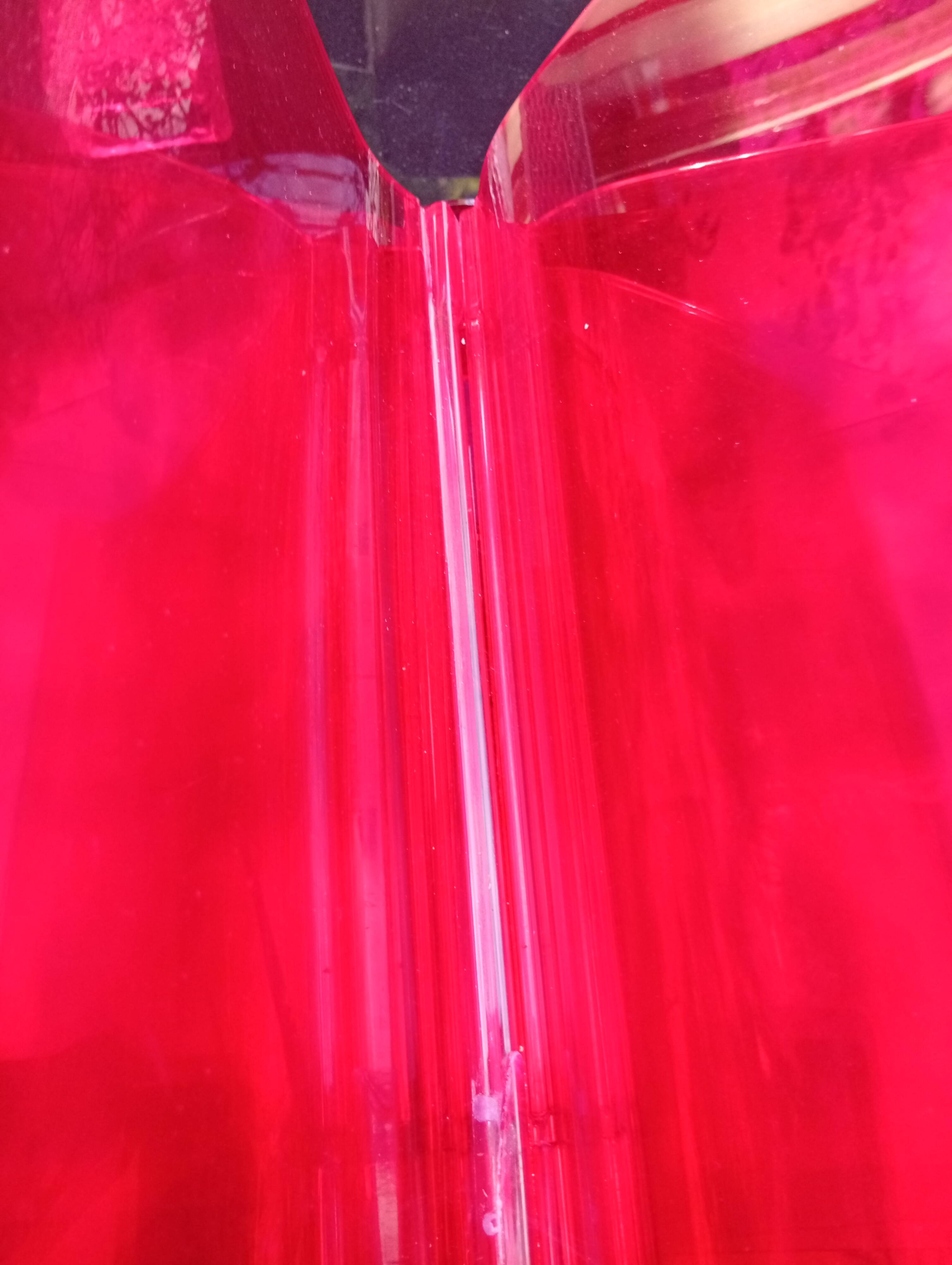 Kartell red magazine rack