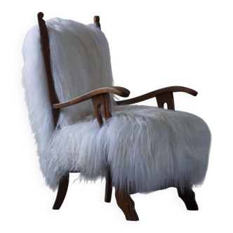 Henning Kjærnulf, armchair reupholstered in long-haired Icelandic sheepskin, 1950