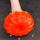 Orange and white opaline vase in the shape of a vintage flower corolla