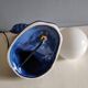 Blue ceramic palm lamp and white opaline globe