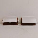 A pair of teak wood wall lamps with plastic shade.