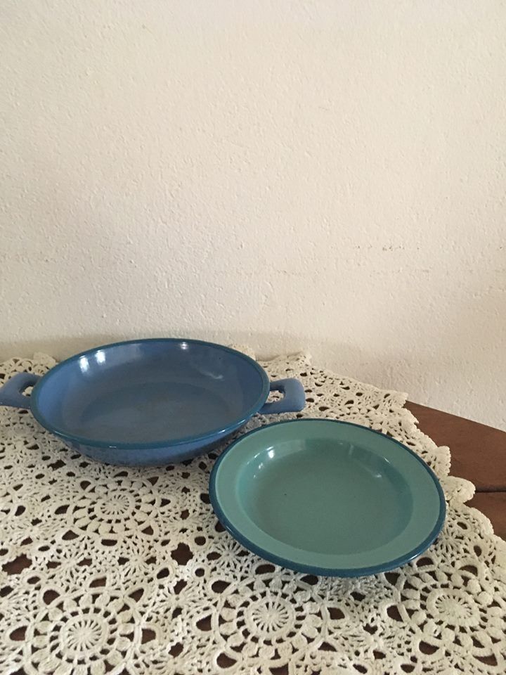 Two matching enameled dishes in green and blue