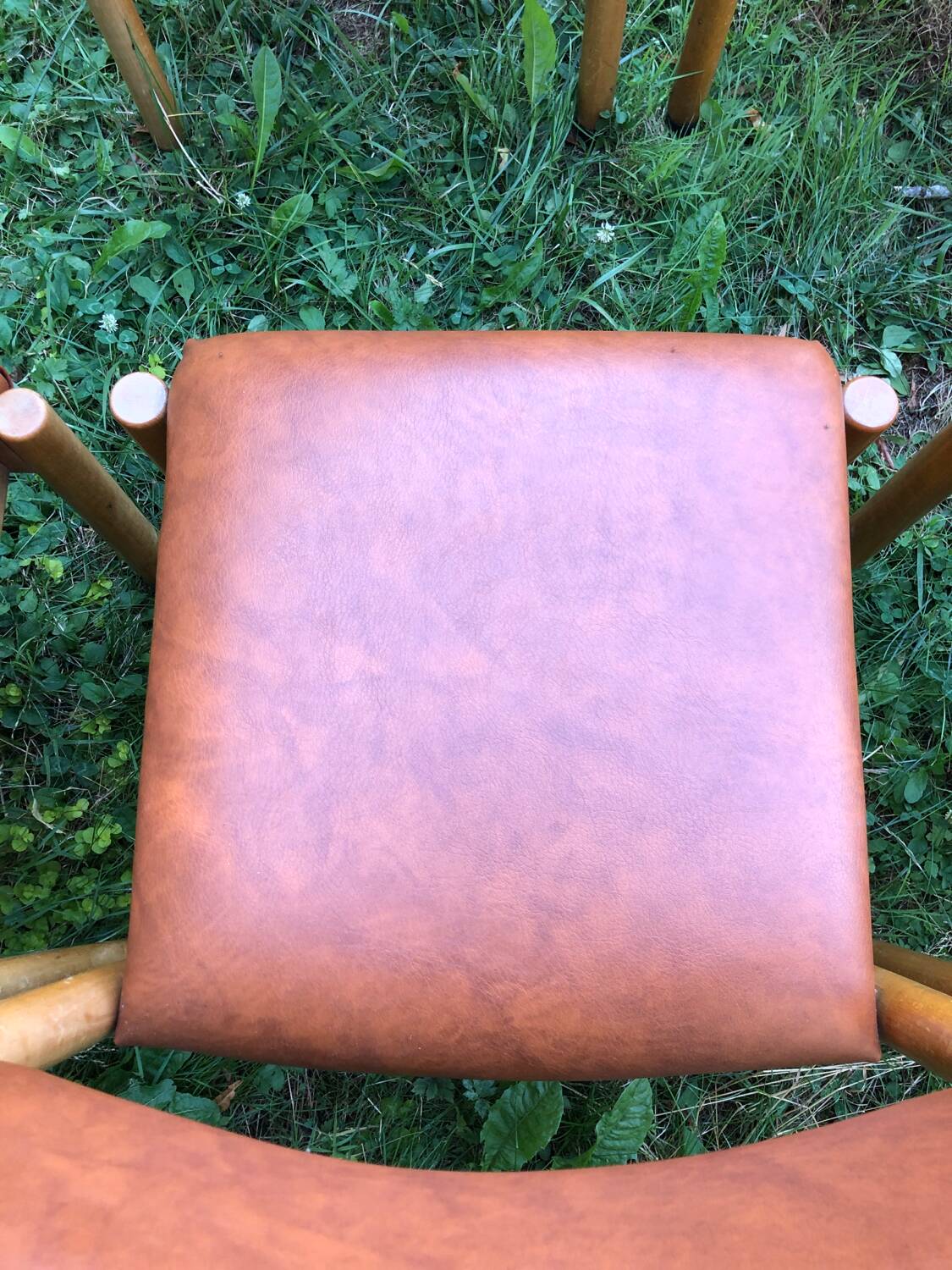 Six wooden and leatherette chairs