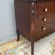 Empire style chest of drawers with gooseneck