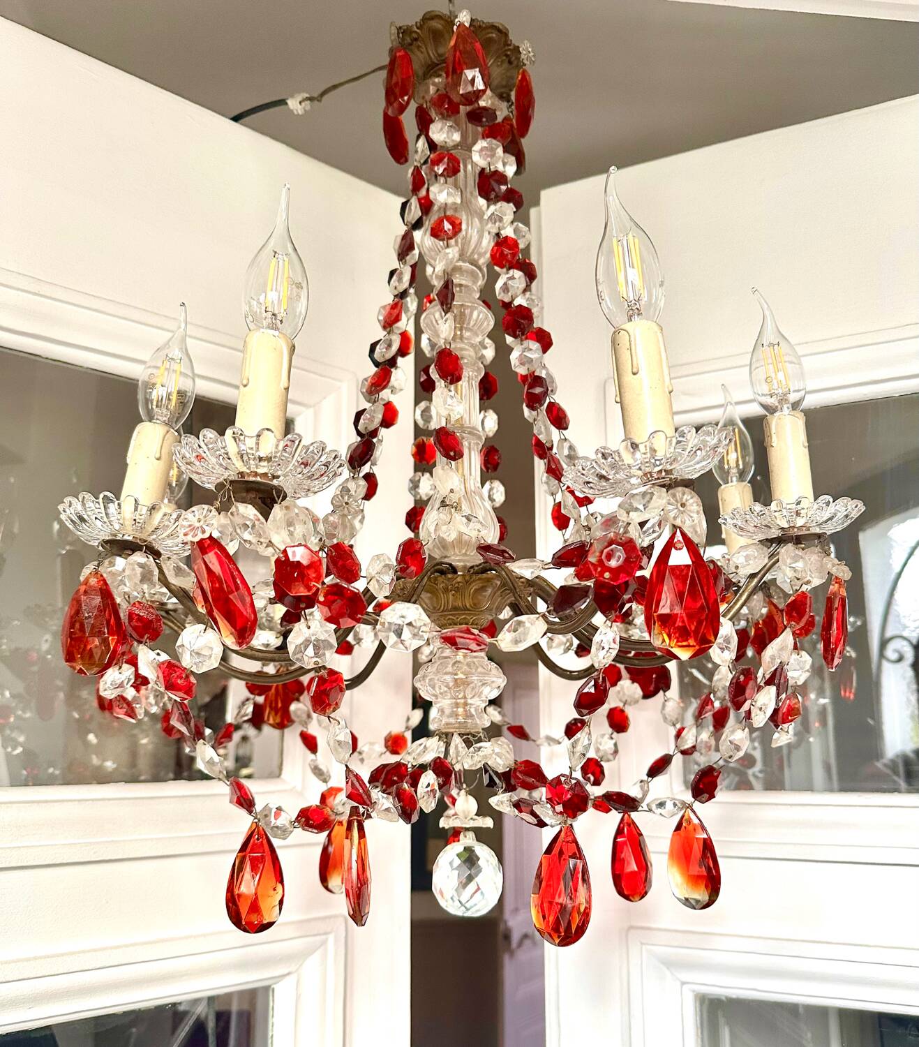 Antique chandelier with red crystal pendants, 9 lights.