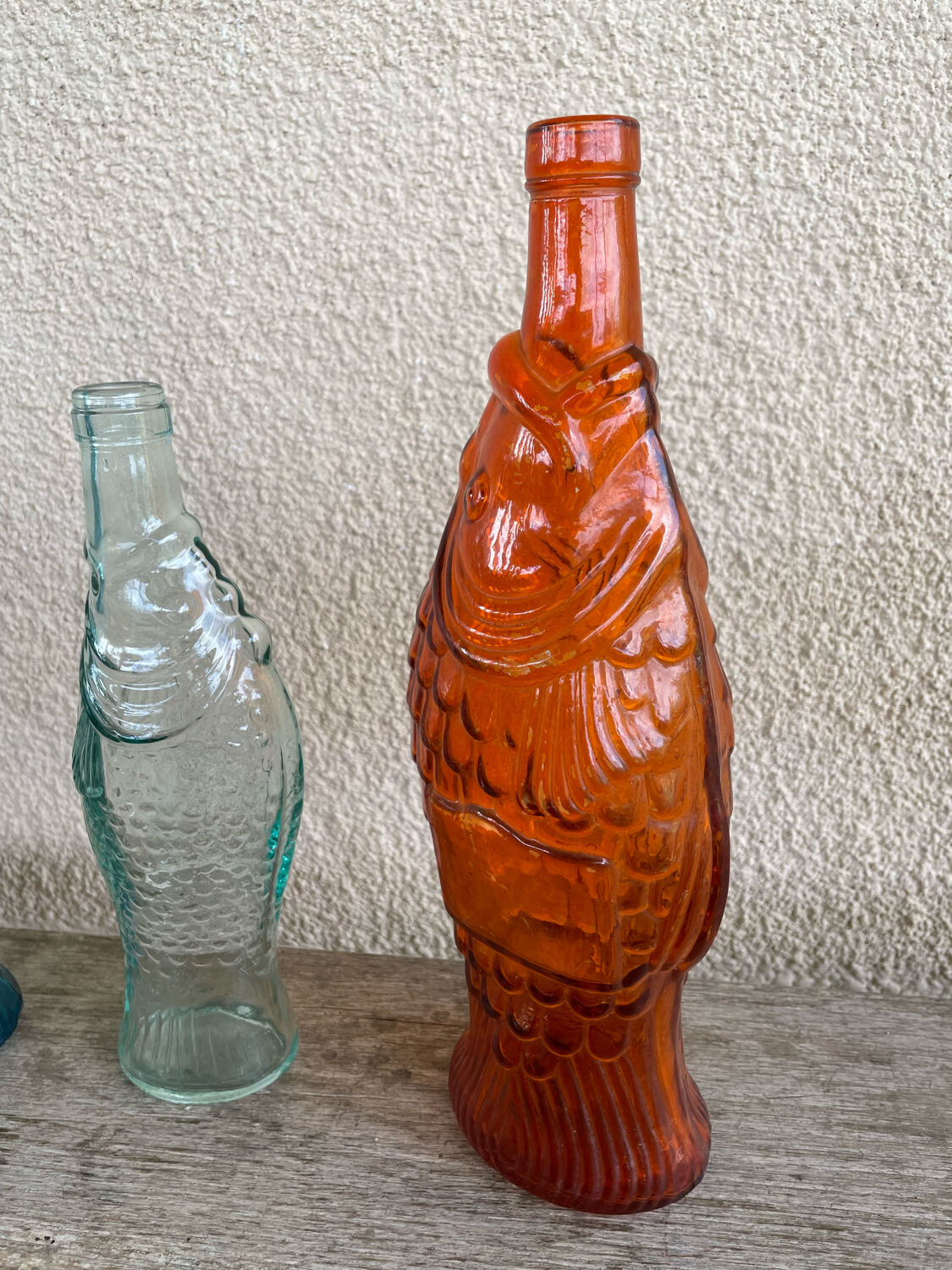 3 glass bottle fish