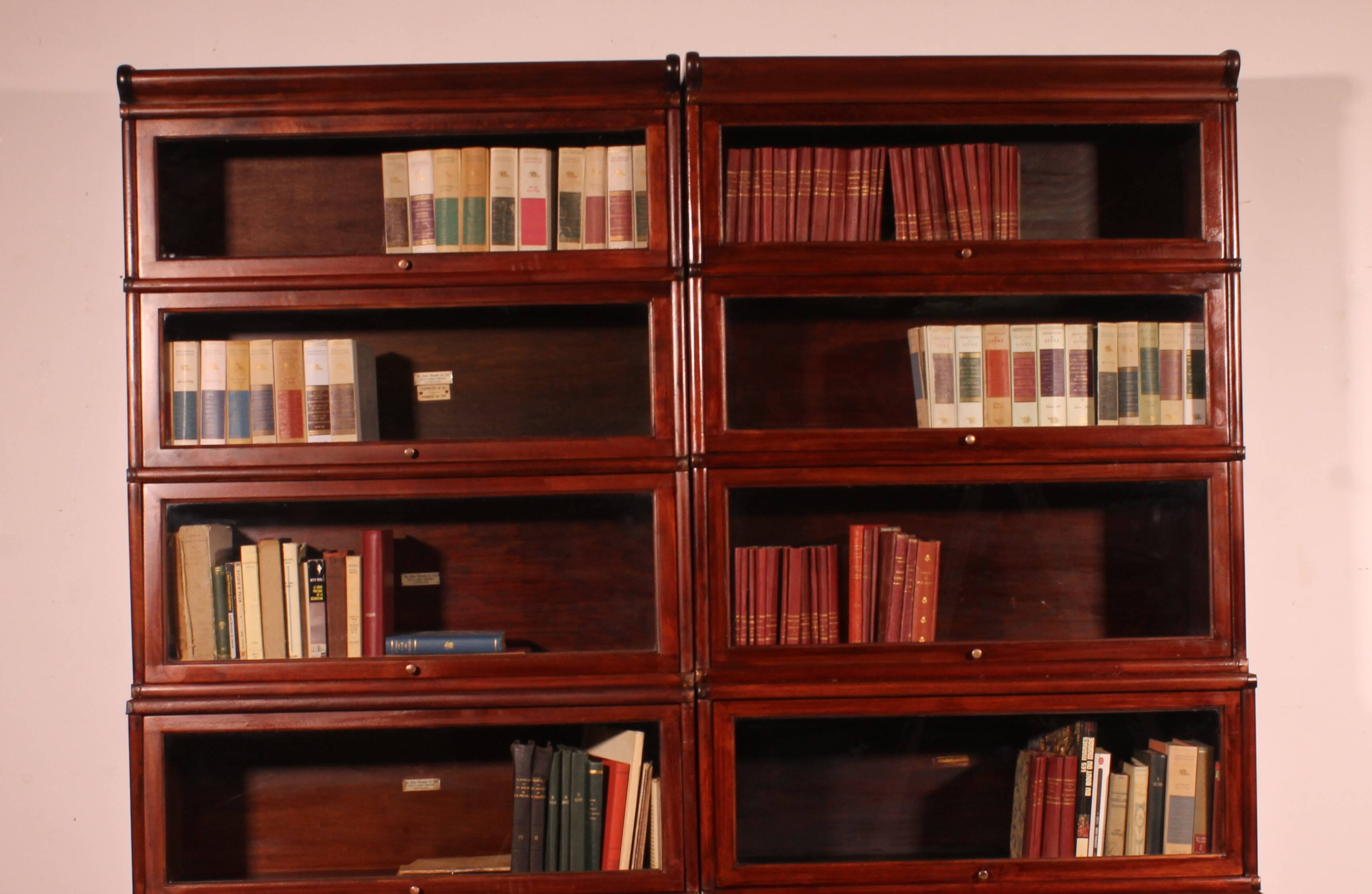 pair of Globe Wernicke London 'waterfall' bookcases in mahogany circa