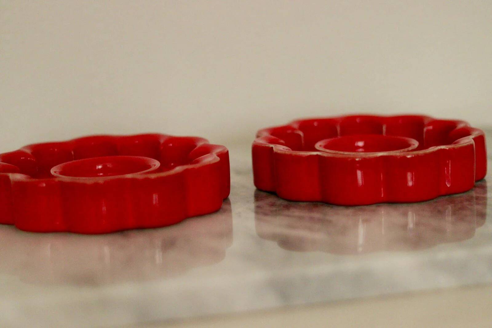 Pair of red Swedish candle holders designed by Gustavsberg