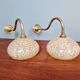 Pair of brass and yellow/white speckled glass wall sconces