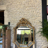 Mirror with parecloses with pediment, gilded with gold leaf