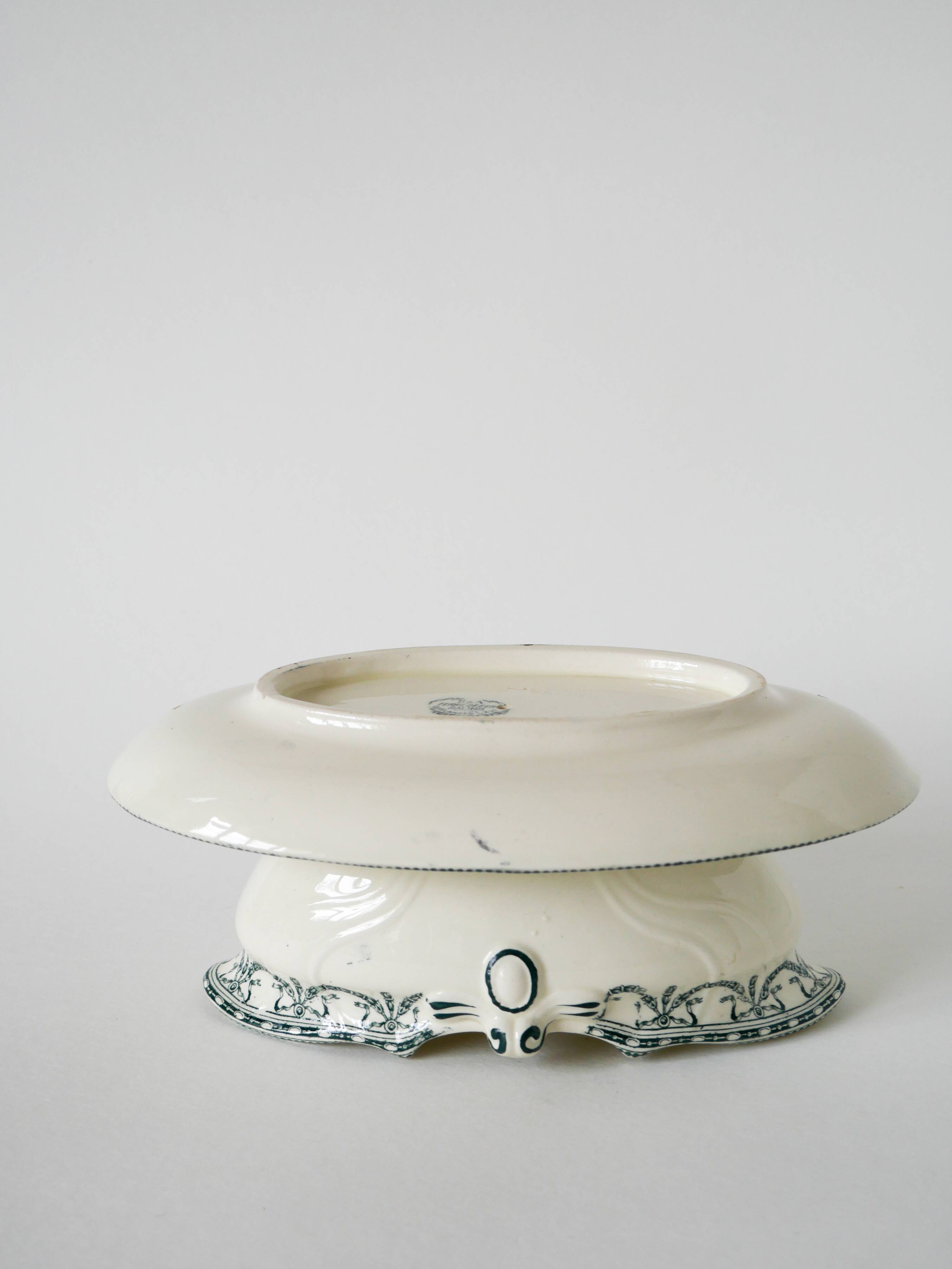 Sauce boat in Salins Iron Earth, "Guirlandes" model, textured version, early 20th century