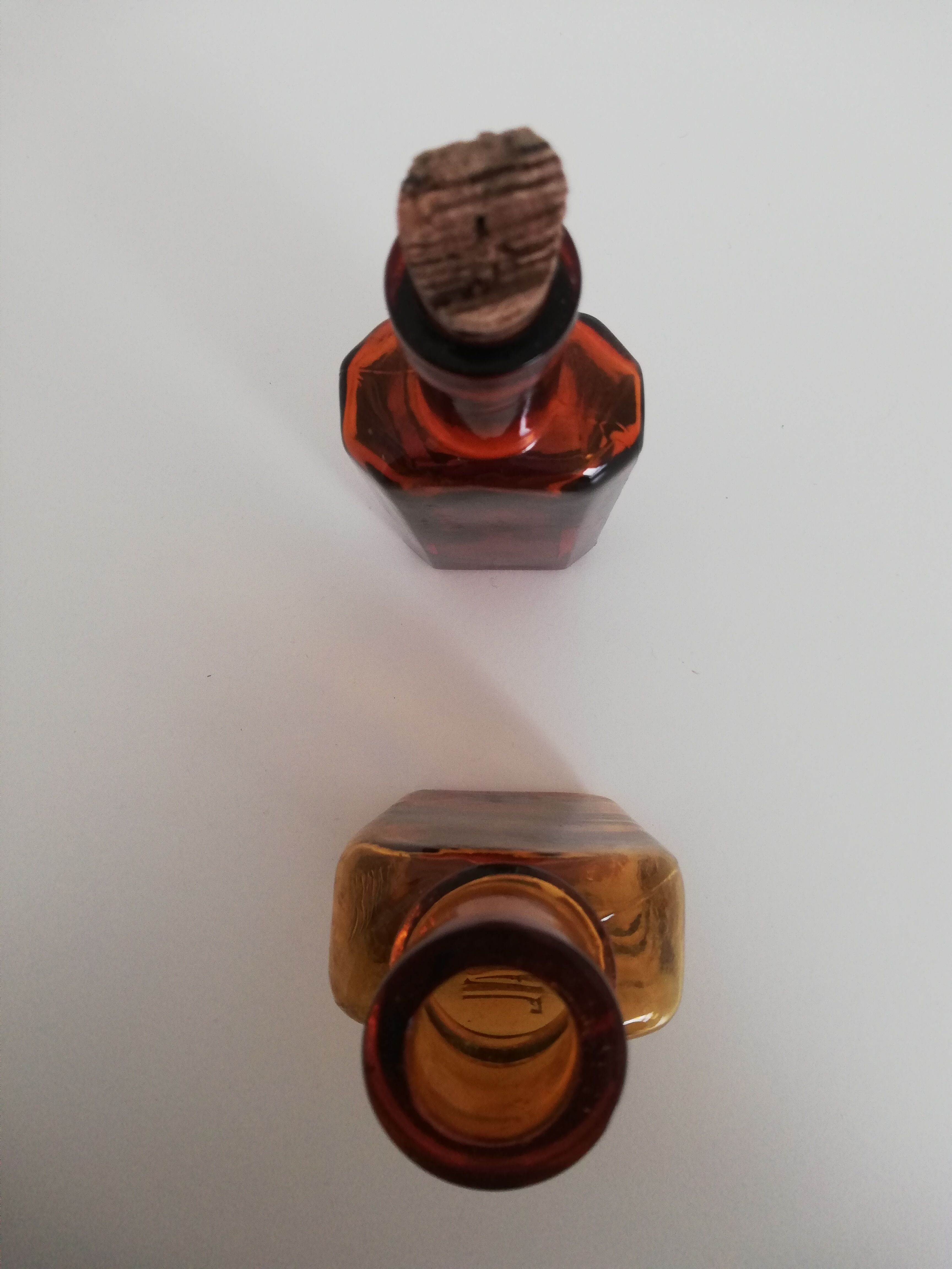 2 amber apothecary bottles