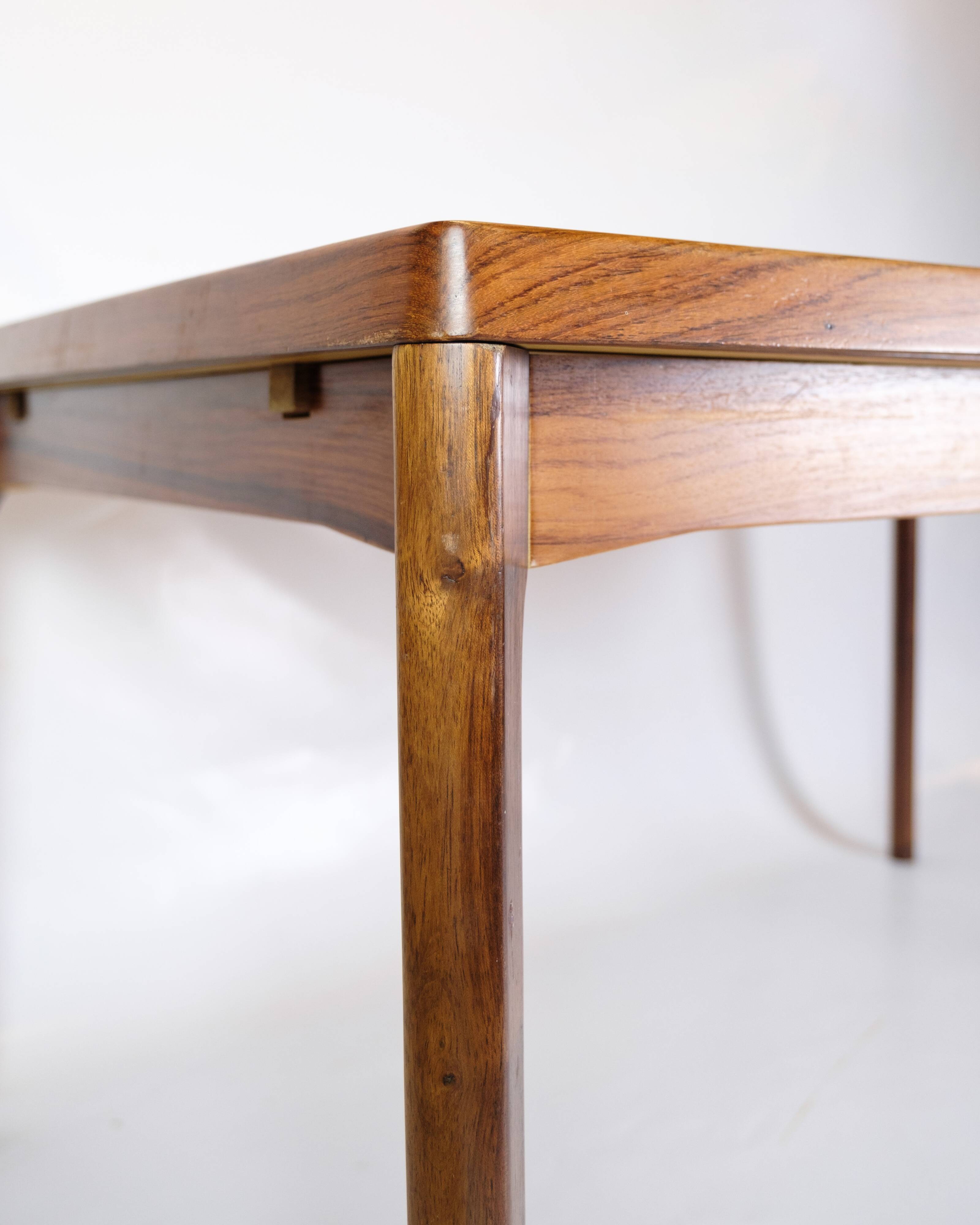 Dining Table With extensions Made In Rosewood By Henning Kjærnulf From 1960s