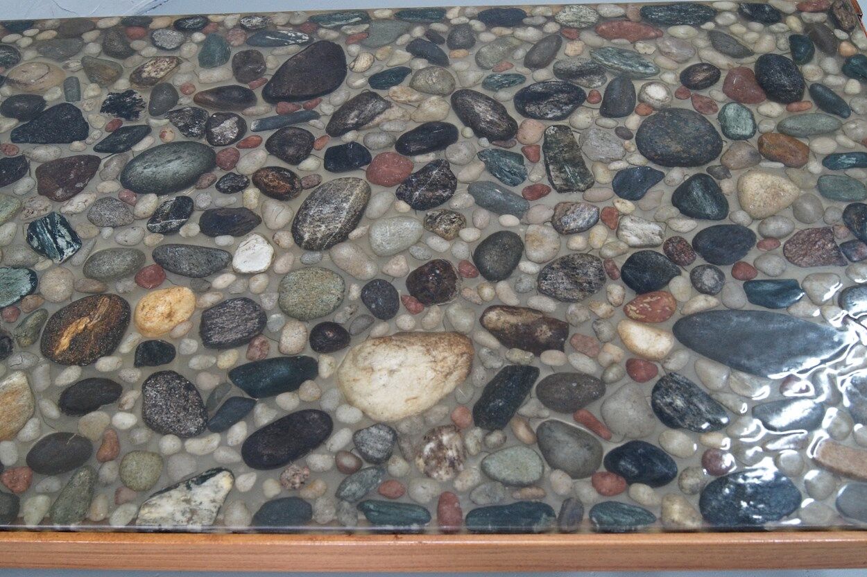 Swedish rosewood and pebbles coffee table in the style of Ib Kofod-Larsen , 1960s