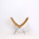Chrome metal magazine rack with woven banana leaves
