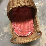 LEIPOLD wicker cradle on wheels and its bedding for dolls.