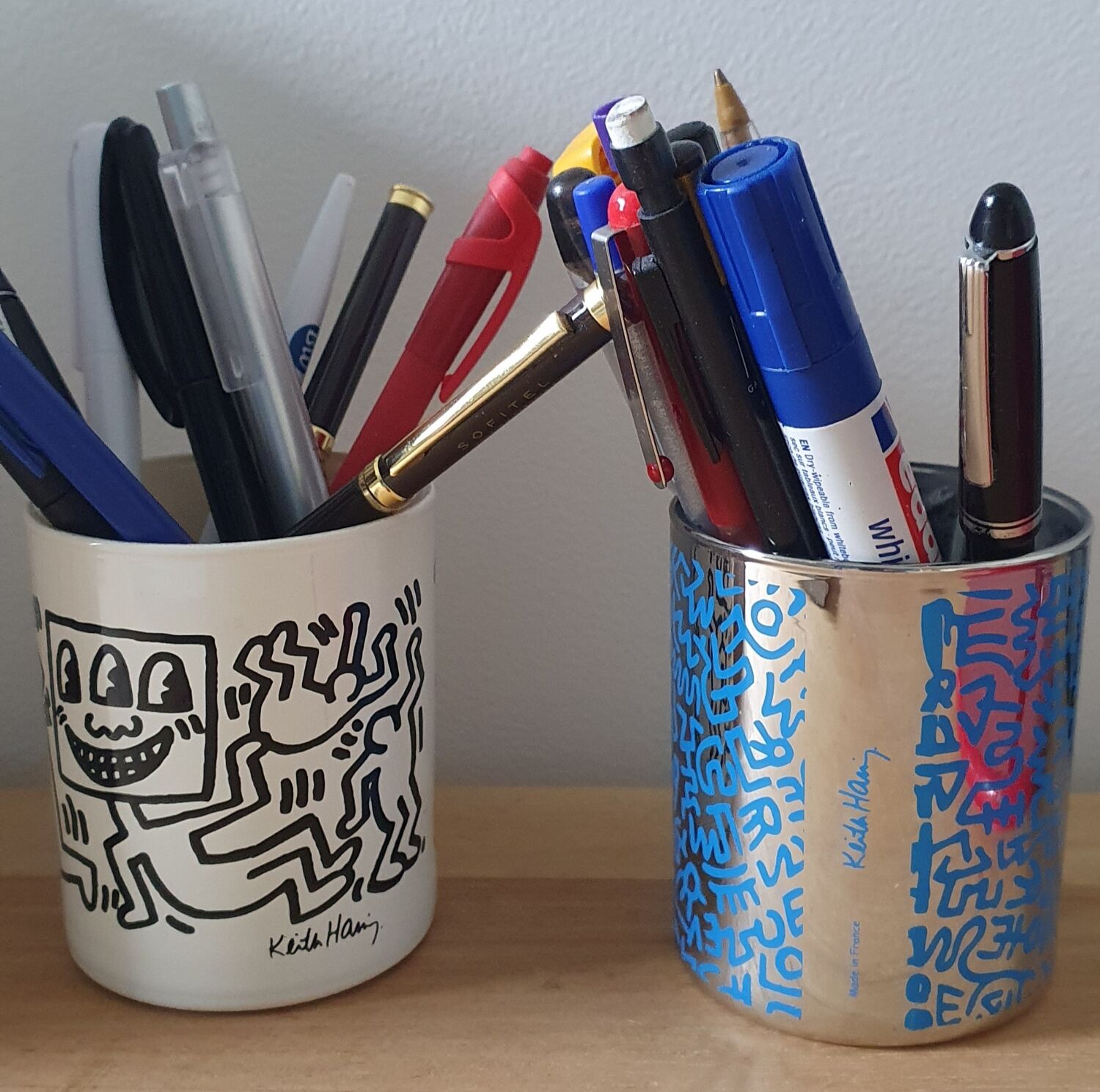 Pair of Keith Haring pots in opaline.