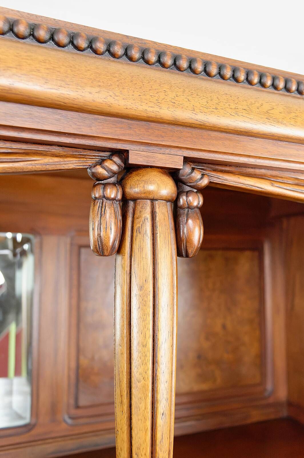 Art Deco showcase bookcase in carved walnut, France, circa 1925