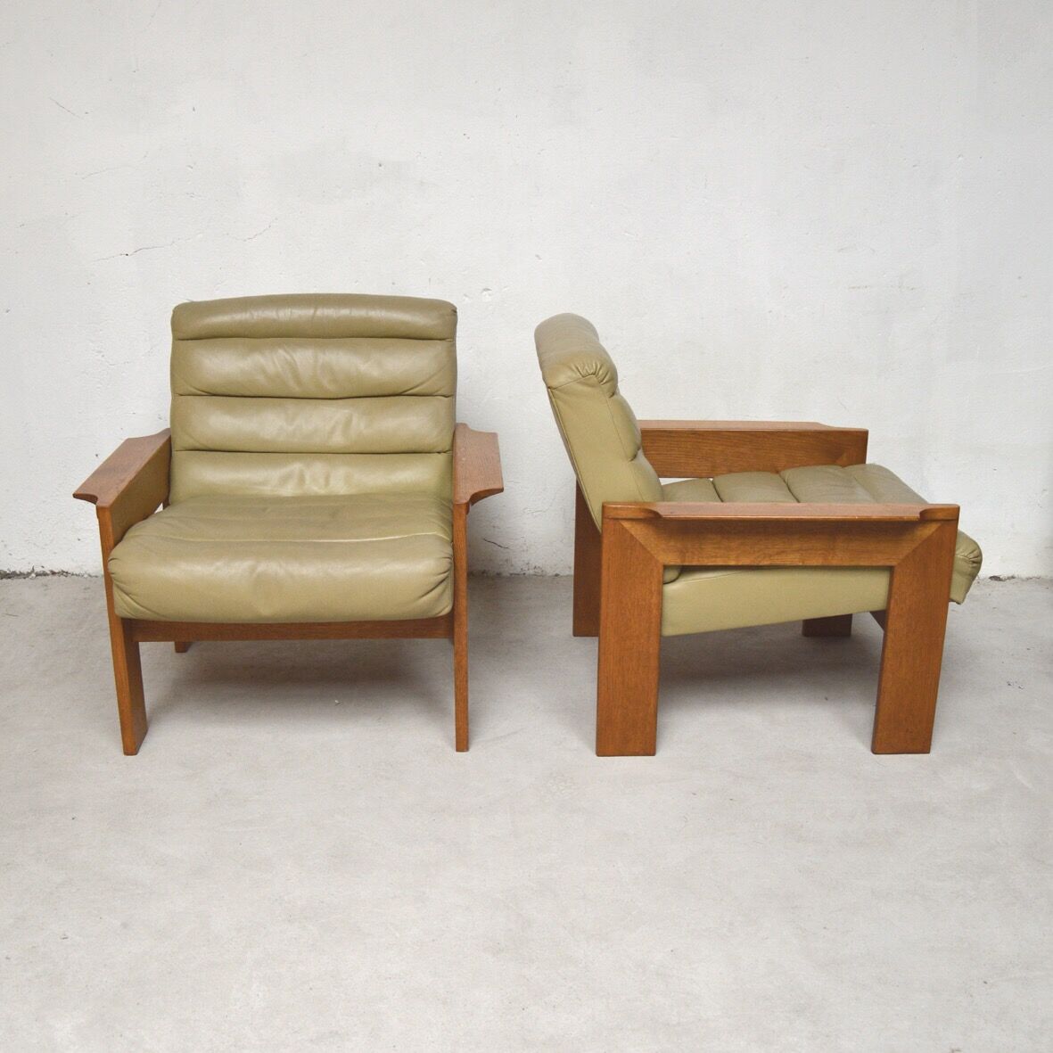 Pair of green leather armchairs 1960