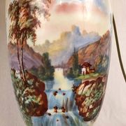 Large pair of 19th century polychrome porcelain vases decorated with landscapes, mounted as lamps