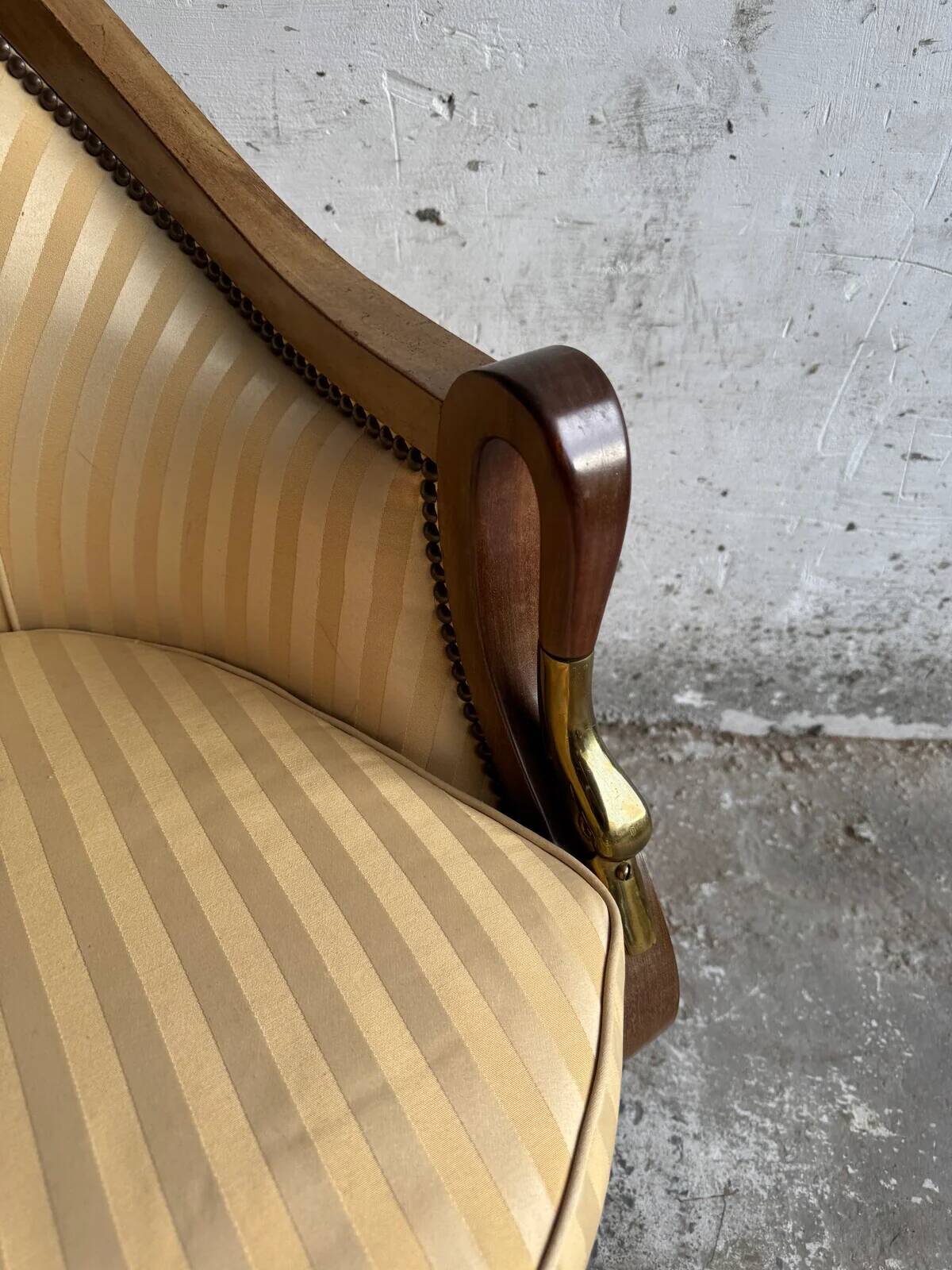 DeCoene antique wood writing desk with beige striped upholstered chair, brass-accented classic set