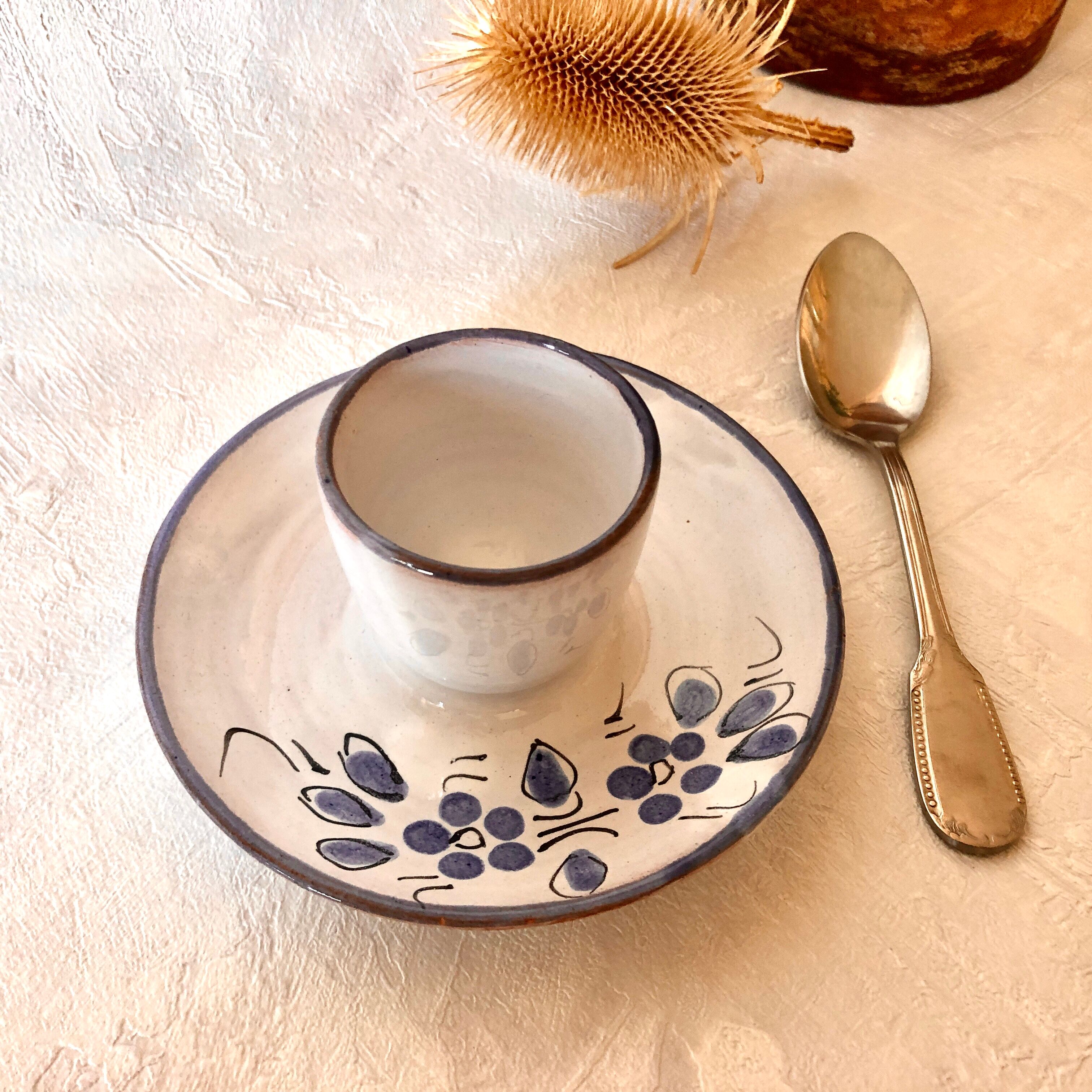 Glazed ceramic shell with painted floral decoration