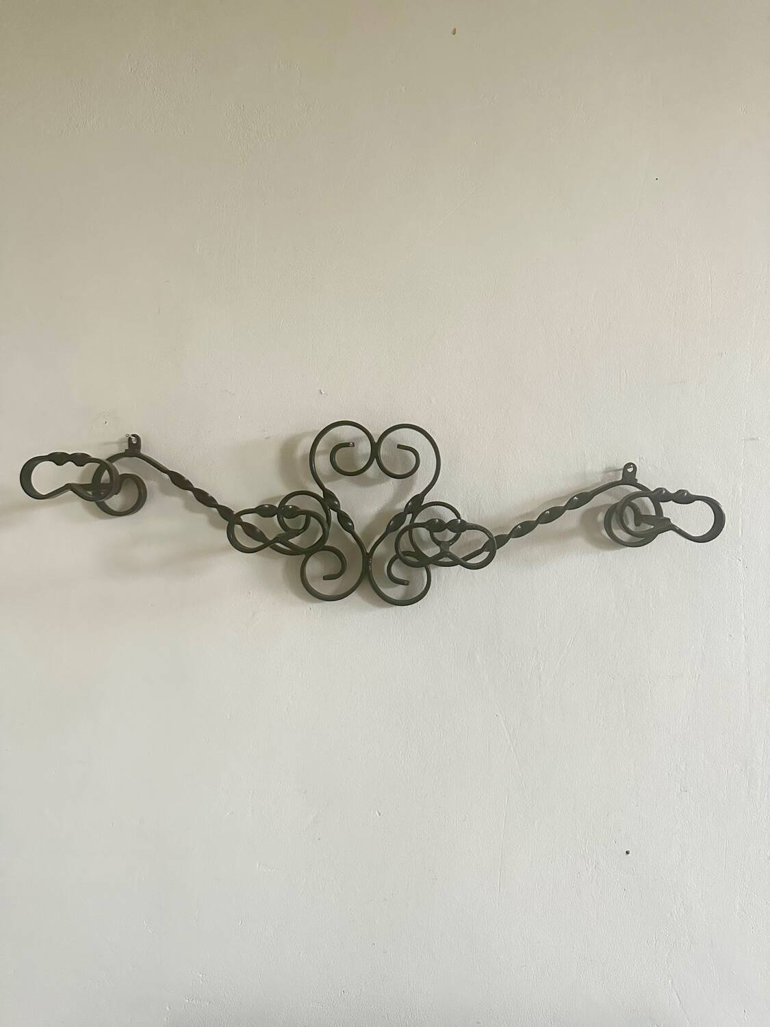 Old wrought iron coat rack