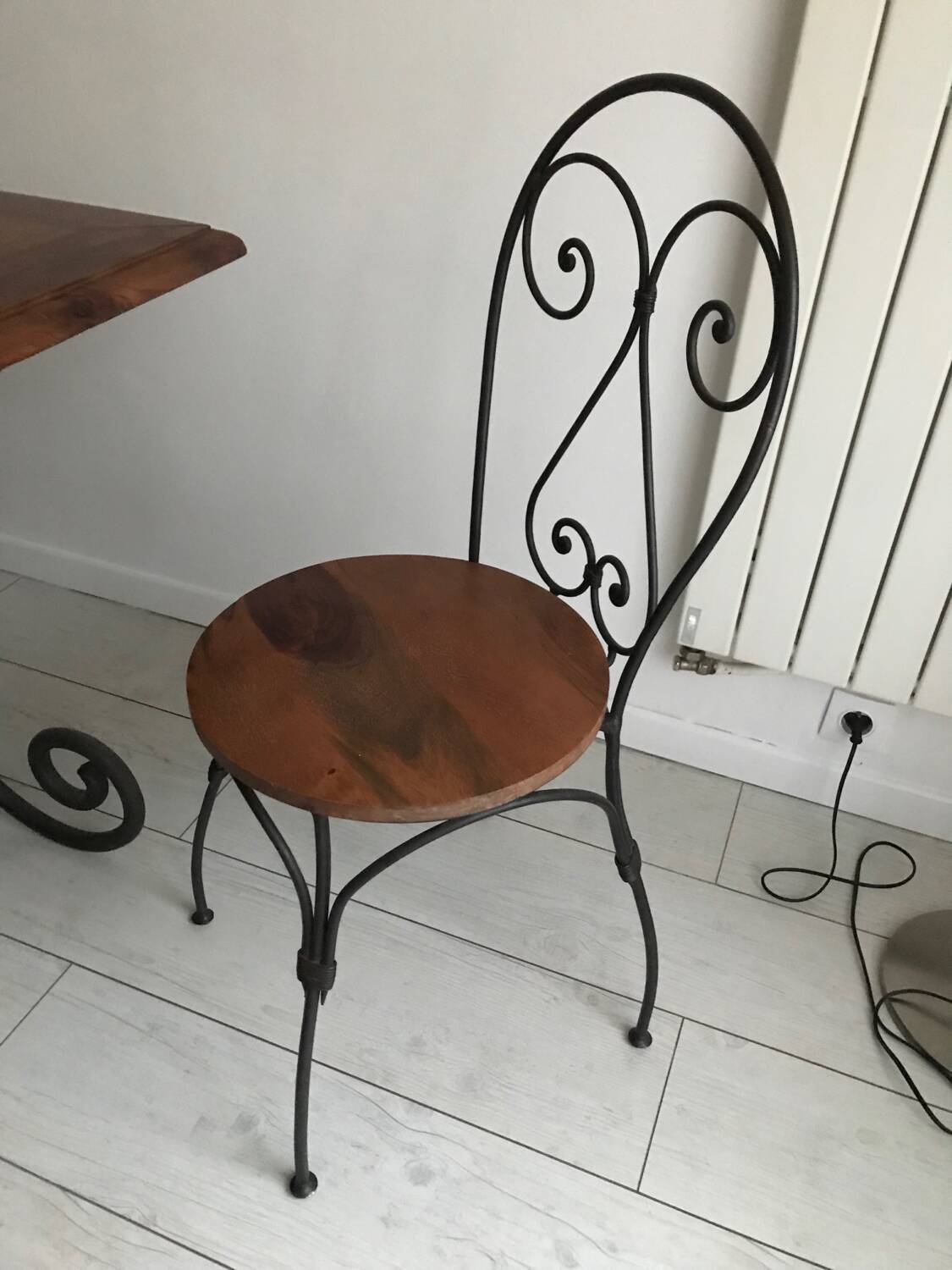 Wrought iron table with wooden top and 6 chairs
