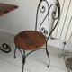 Wrought iron table with wooden top and 6 chairs