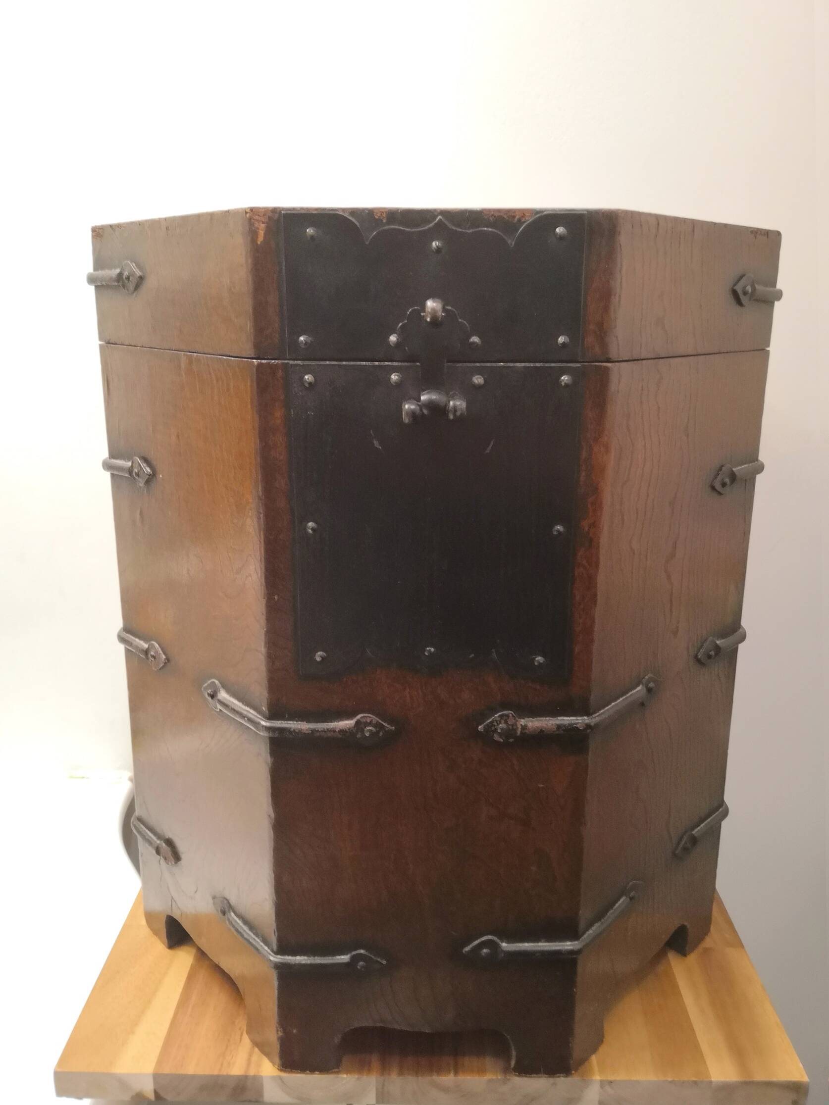 Octagonal wooden chest with metal ornaments from Asia