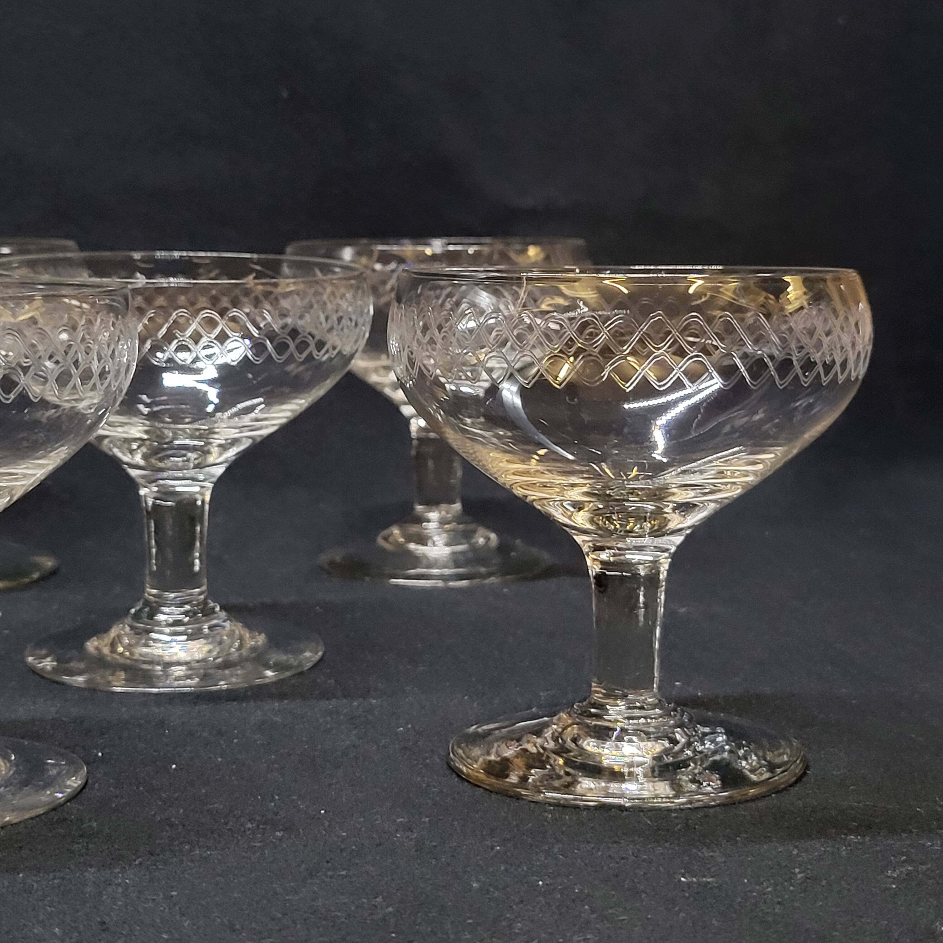 12 old champagne glasses in blown and engraved glass