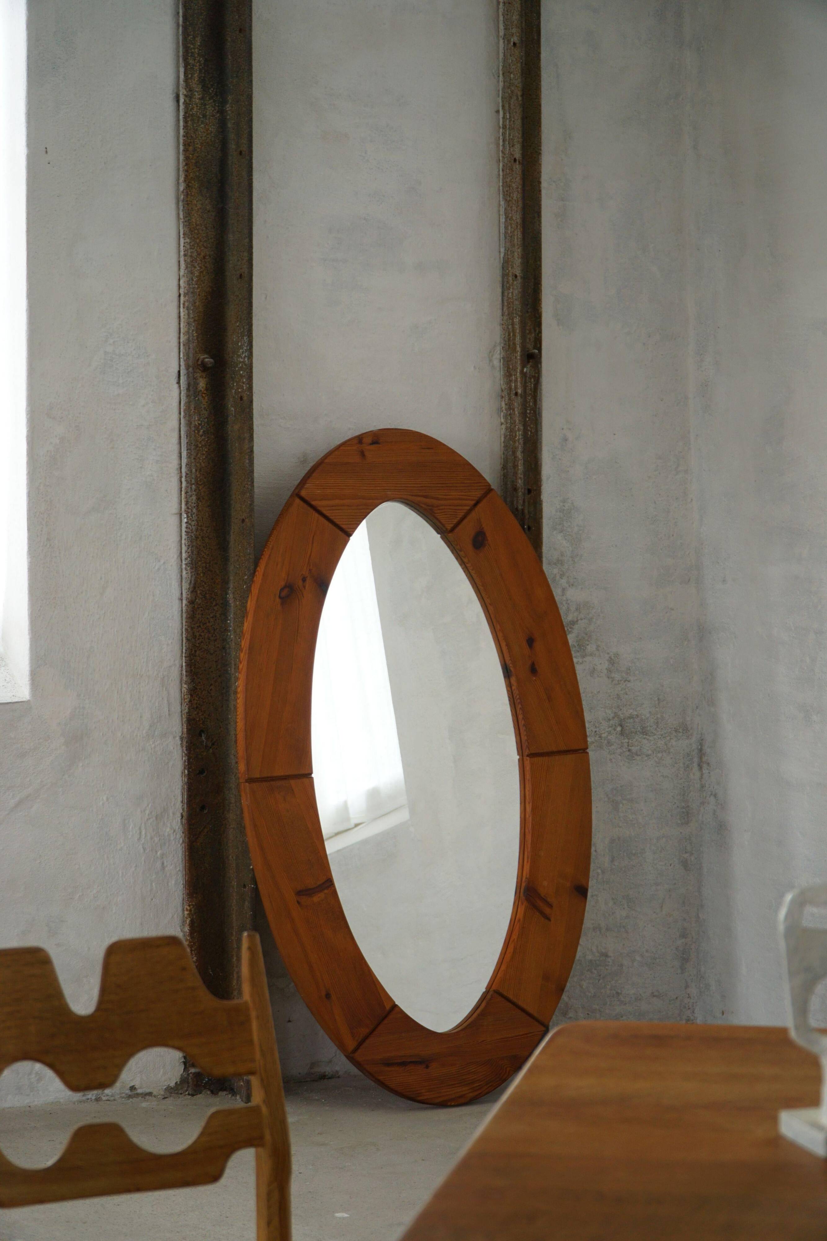 Large oval wall mirror in solid pine by Glasmäster Markaryd, Sweden, 1960s.